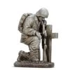 Soldier Kneeling At Cross